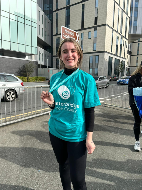 Grace Walker, Receptionist at the Clatterbridge Private Clinic holding her medal after abseiling down the Clatterbridge Cancer Hospital in Liverpool to raise money for the Clatterbridge Cancer Charity. 
