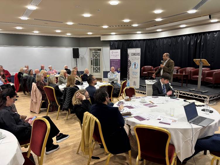 A photograph of the 'Meet the Clatterbridge Private Consultants' event in the Isle of Man, Dr Raj Sripadam giving a speech on Breast and GI cancer
