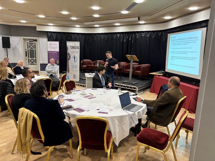 A photograph of the 'Meet the Clatterbridge Private Consultants' event in the Isle of Man, Dr Ian Lampkin providing a talk on Prostate, Benign Conditions and Skin cancer 