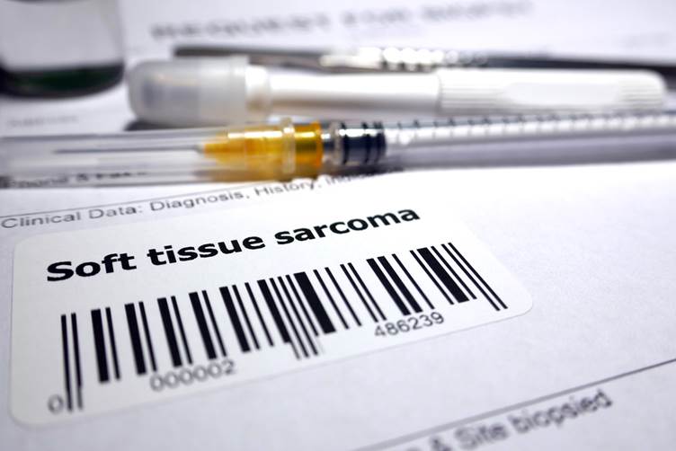 A picture of a sticker on medical records that says 'soft tissue sarcoma' 